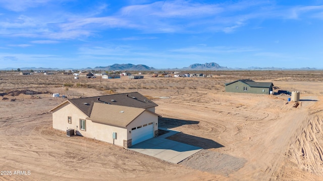 birds eye view of property featuring a mountain view