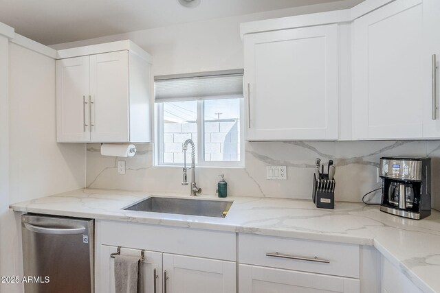 4402 E Montecito Ave, Phoenix, AZ 85018 - kitchen with a sink, dishwasher, and white cabinetry