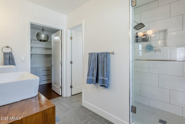4402 E Montecito Ave, Phoenix, AZ 85018 - bathroom with a stall shower, baseboards, tile patterned flooring, and a sink