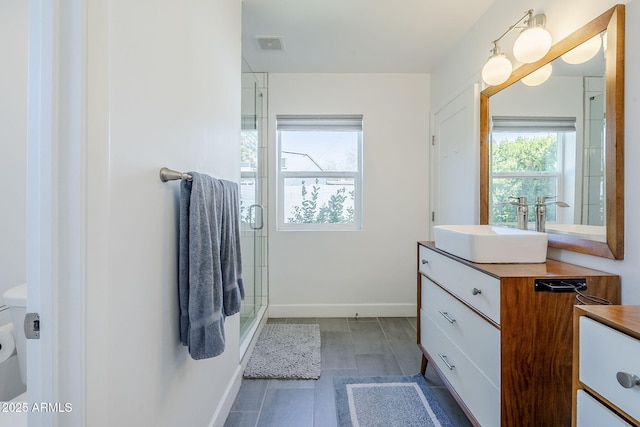 4402 E Montecito Ave, Phoenix, AZ 85018 - full bath featuring vanity, baseboards, and a stall shower