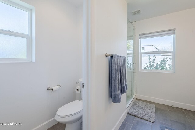 4402 E Montecito Ave, Phoenix, AZ 85018 - bathroom featuring baseboards, toilet, a shower stall, and tile patterned flooring