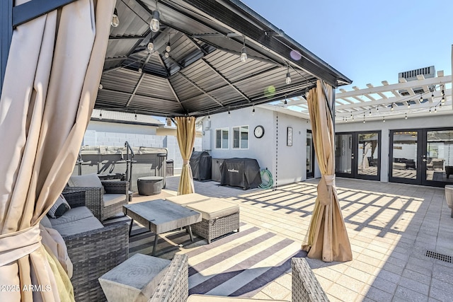 4402 E Montecito Ave, Phoenix, AZ 85018 - view of patio with a hot tub, a gazebo, and french doors