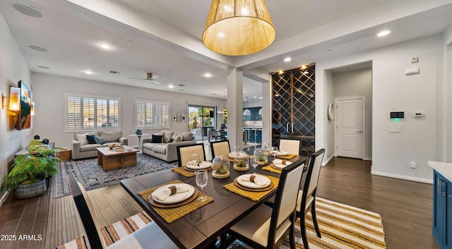 dining space with dark wood finished floors, recessed lighting, baseboards, and a ceiling fan