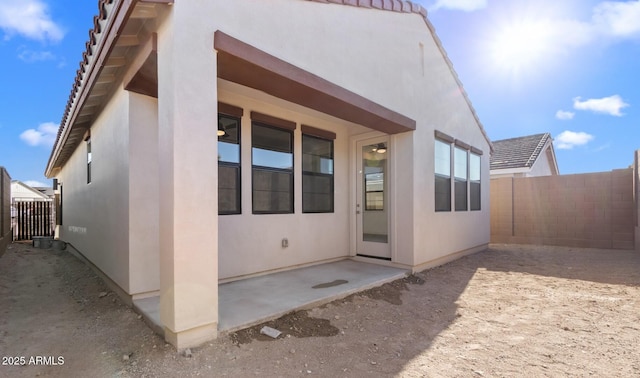 view of side of property featuring a patio