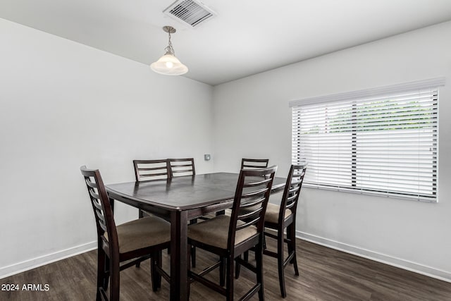 dining area with dark wood-type flooring