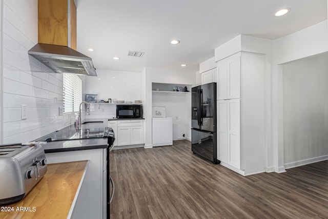 kitchen featuring backsplash, wall chimney exhaust hood, dark hardwood / wood-style floors, sink, and black appliances