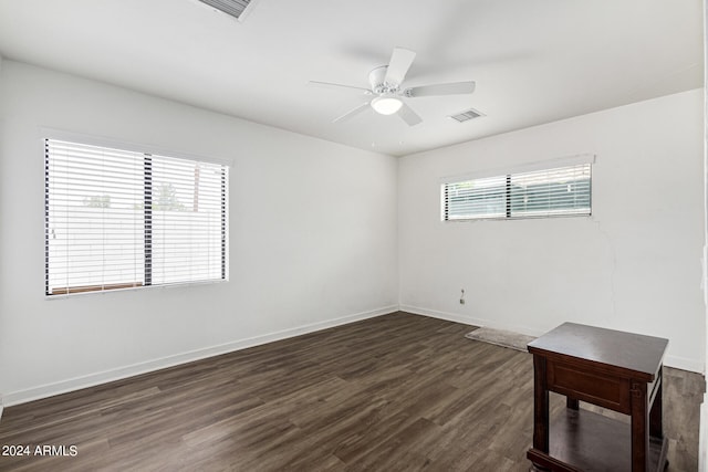 empty room featuring hardwood / wood-style flooring and ceiling fan