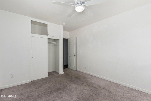 unfurnished bedroom with ceiling fan, a closet, and carpet floors