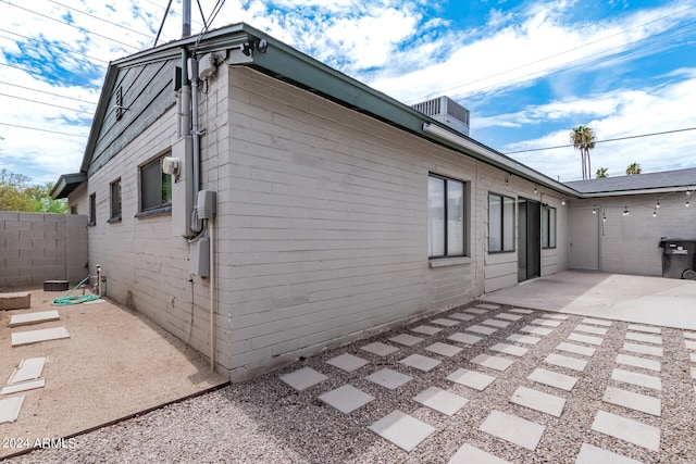 view of side of home featuring a patio area