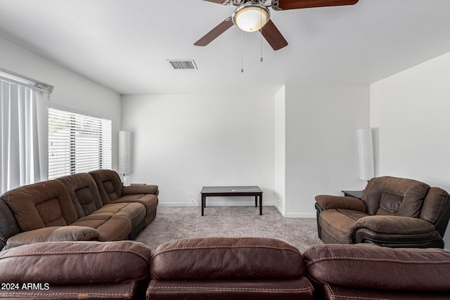 carpeted living room featuring ceiling fan