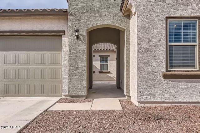 entrance to property featuring a garage