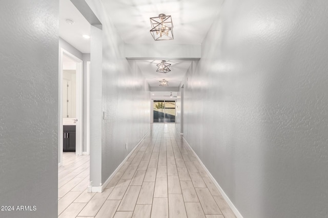 hallway with light wood-type flooring