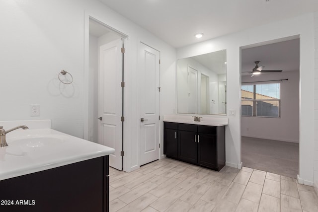 bathroom with ceiling fan and vanity