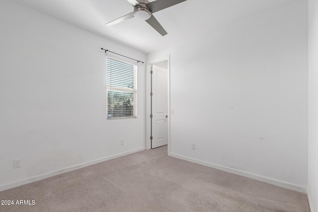 carpeted empty room with ceiling fan