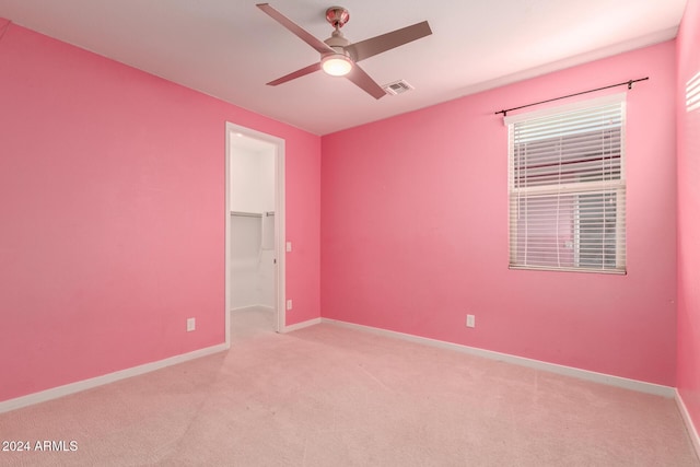 carpeted empty room with ceiling fan