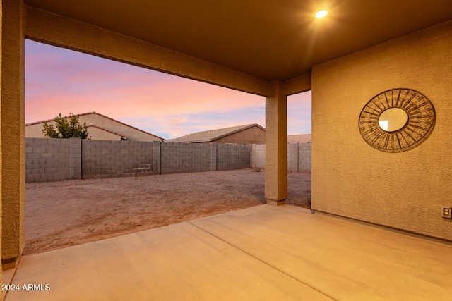 view of patio terrace at dusk