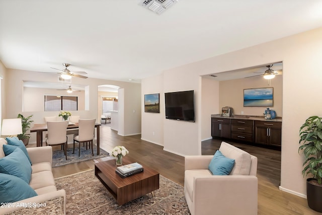 living room featuring dark hardwood / wood-style flooring