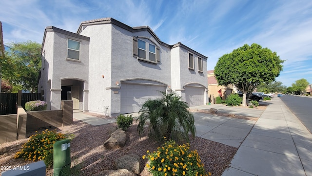 8854 W Aster Dr, Peoria, AZ 85381 - view of property with an attached garage, driveway, and stucco siding