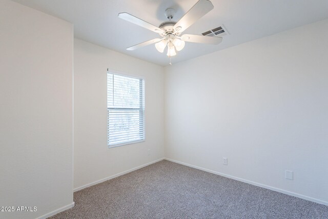8854 W Aster Dr, Peoria, AZ 85381 - spare room with carpet floors, baseboards, and a ceiling fan