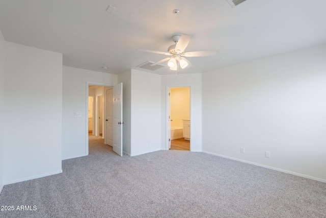8854 W Aster Dr, Peoria, AZ 85381 - unfurnished bedroom with light colored carpet, baseboards, and ceiling fan