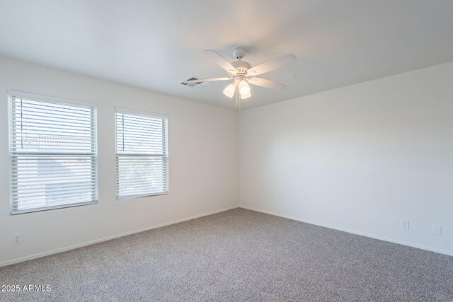 8854 W Aster Dr, Peoria, AZ 85381 - unfurnished room featuring carpet, a ceiling fan, and baseboards