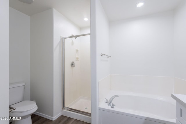 8854 W Aster Dr, Peoria, AZ 85381 - full bath with wood finished floors, a shower stall, toilet, a garden tub, and recessed lighting