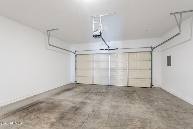 8854 W Aster Dr, Peoria, AZ 85381 - garage with baseboards, electric panel, and a garage door opener