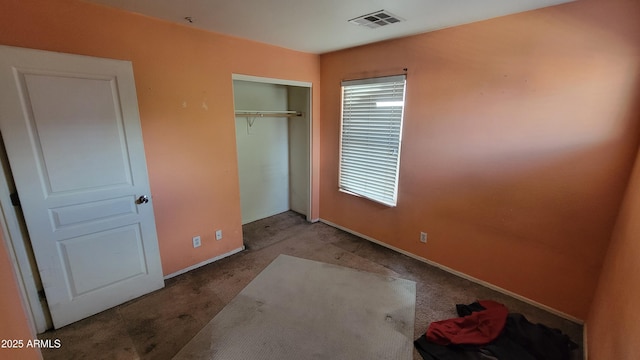 8854 W Aster Dr, Peoria, AZ 85381 - unfurnished bedroom featuring carpet flooring, a closet, and baseboards
