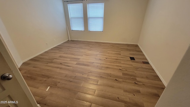 8854 W Aster Dr, Peoria, AZ 85381 - spare room with wood finished floors and baseboards