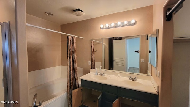 8854 W Aster Dr, Peoria, AZ 85381 - bathroom with double vanity and shower / tub combo with curtain