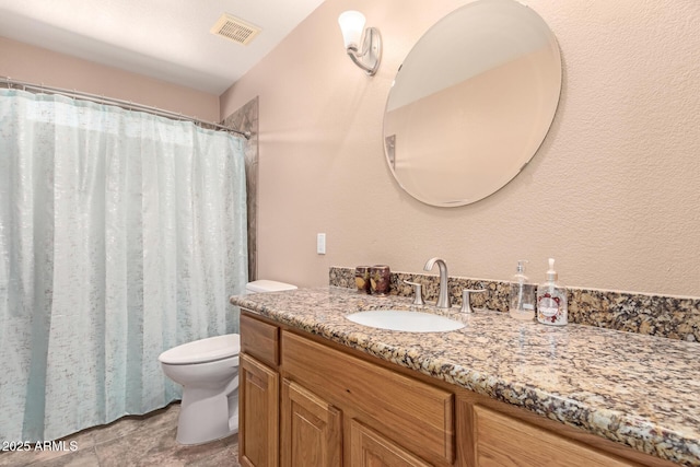 bathroom with vanity, toilet, and a shower with shower curtain