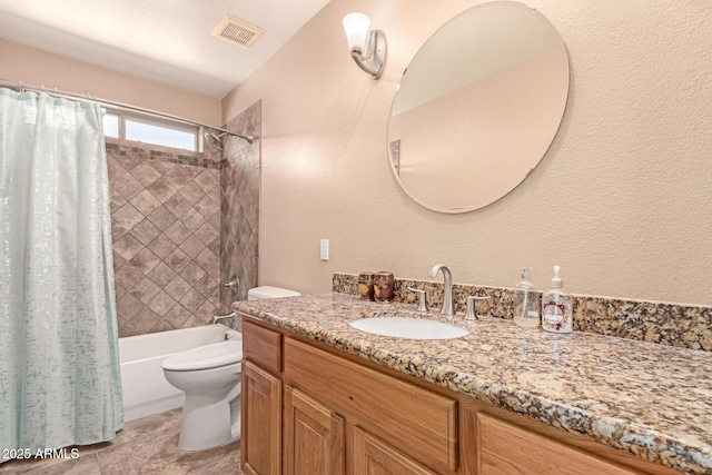 full bathroom with vanity, toilet, and shower / bath combo