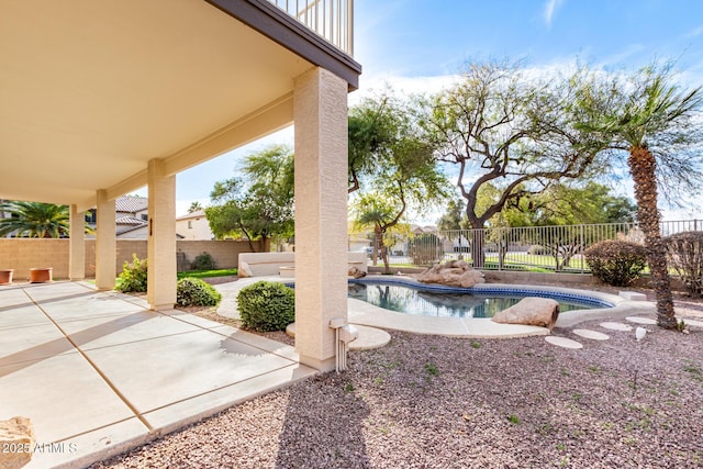 exterior space featuring a fenced in pool