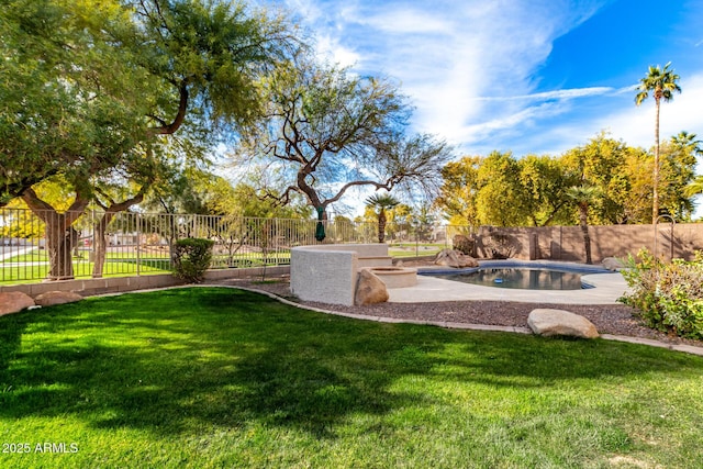 view of yard featuring a fenced in pool