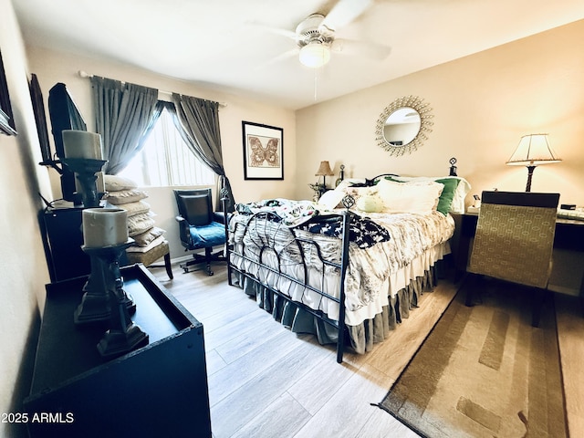 bedroom featuring a ceiling fan and wood finished floors