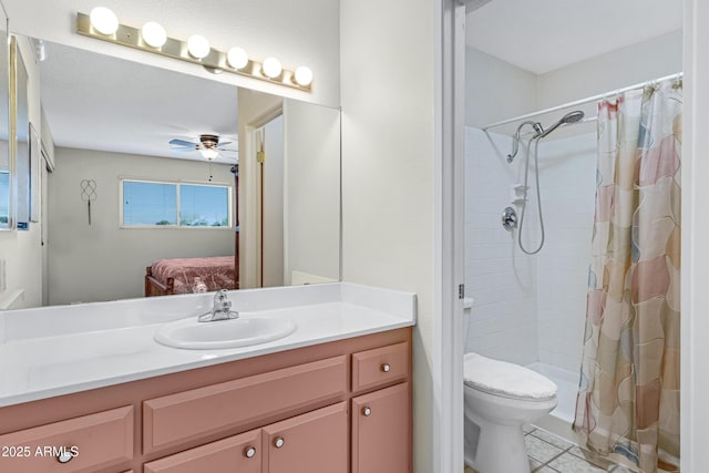 bathroom with ceiling fan, vanity, toilet, and curtained shower