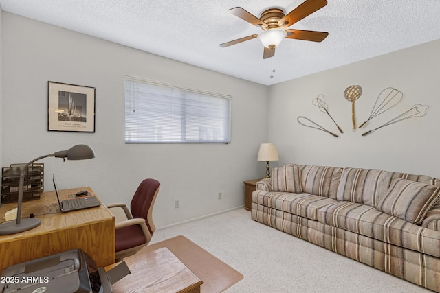 carpeted office with ceiling fan and a textured ceiling