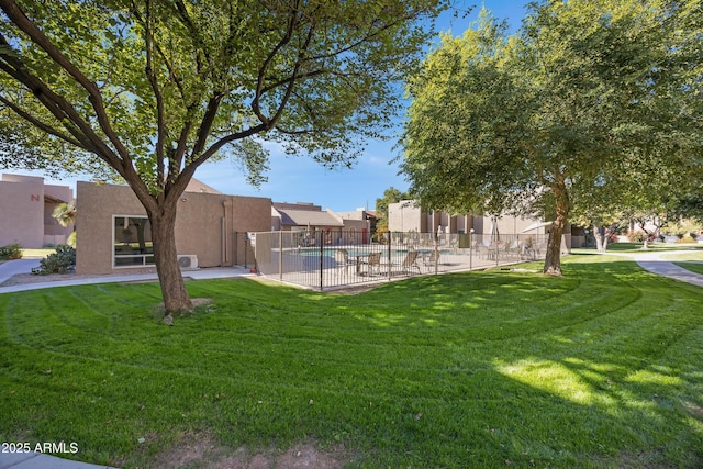 view of yard featuring a community pool