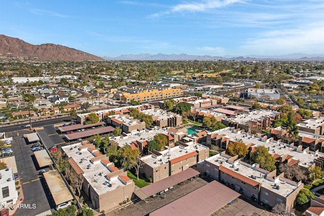 birds eye view of property with a mountain view