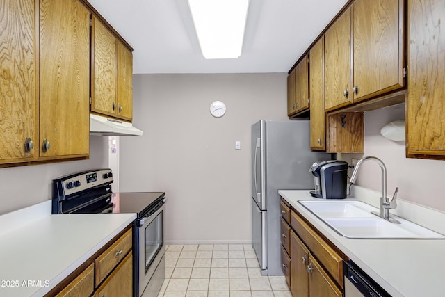 kitchen featuring light tile patterned flooring, appliances with stainless steel finishes, and sink