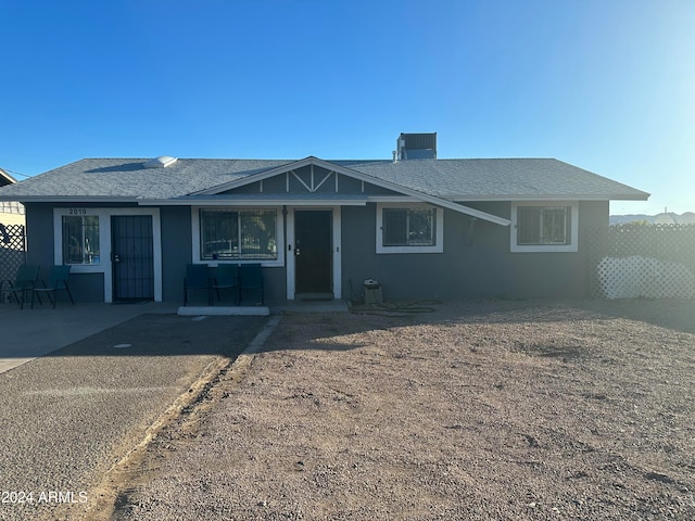 view of front of property featuring a patio and central AC unit