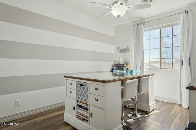 4502 E Night Owl Ln, Cave Creek, AZ 85331 - office space featuring baseboards, ceiling fan, visible vents, and wood finished floors