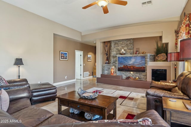4502 E Night Owl Ln, Cave Creek, AZ 85331 - living area featuring ceiling fan, a fireplace, visible vents, and baseboards