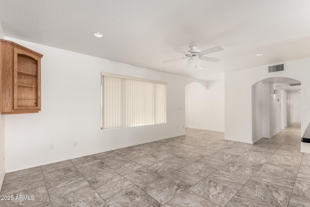 spare room featuring ceiling fan