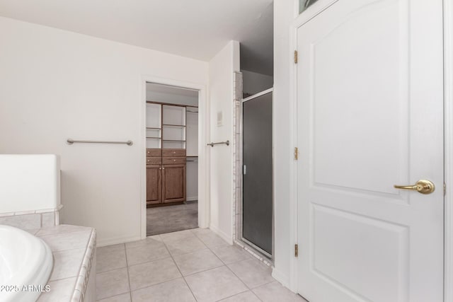 bathroom with tile patterned flooring and plus walk in shower