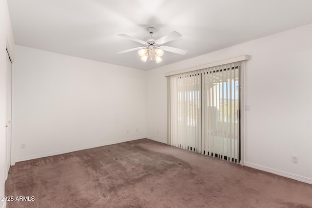 empty room featuring carpet and ceiling fan