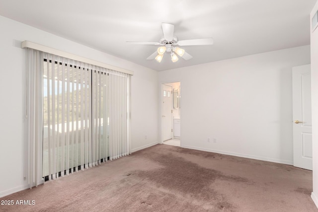 carpeted empty room featuring ceiling fan