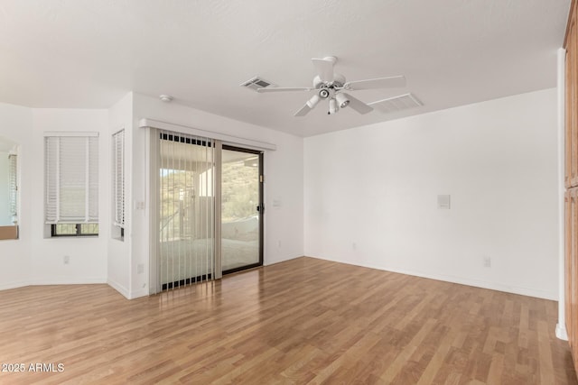 spare room featuring ceiling fan and light hardwood / wood-style floors