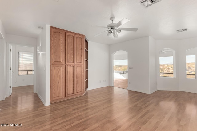 interior space with light hardwood / wood-style floors and ceiling fan