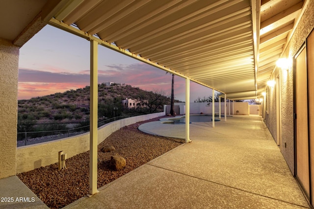 view of patio terrace at dusk